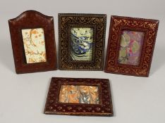 FOUR LEATHER PHOTOGRAPH FRAMES.