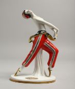 AN ART DECO PORCELAIN DANCER. 6ins high.