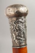 A MALACCA CANE with Chinese silver handle. 35ins long.