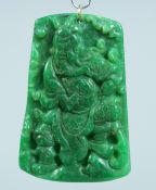A GOLD RING JADE PENDANT 6cm long.