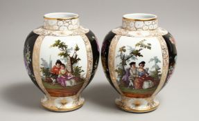A PAIR OF DRESDEN AUGUSTUS REX VASES AND COVERS with panels of figures and flowers. A R in blue.