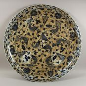 A MASSIVE CHINESE BLUE AND WHITE DISH decorated with carp. 39ins diameter.