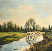 Pamela Coward (20th Century) A river landscape with a stone bridge with reflections on the water,