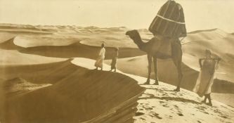 A photograph of travellers with a Camel in North Africa, with monogram, 10.5