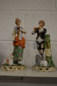A pair of porcelain figures of shepherd and shepherdess.