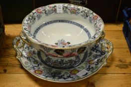 A Staffordshire pottery twin handled bowl and stand.