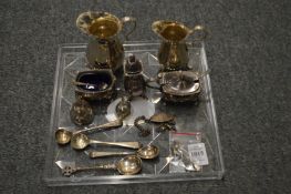 Two small silver cream jugs, a silver three piece condiment set and other items.
