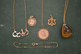 A Chinese pendant and chain, the pendant stamped 14k, together with similar jewellery.