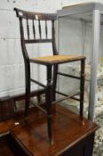A 19th century mahogany and cane seated highchair.