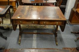 A Georgian style flame mahogany sofa table.