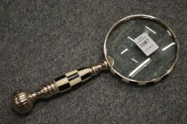 A decorative magnifying glass.