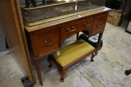 An Edwardian inlaid mahogany writing table.
