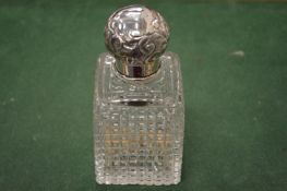 A good cut glass scent bottle with silver mount.