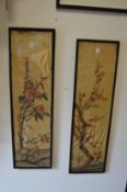 A pair of Japanese embroidered silk panels, framed and glazed.