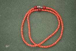 A coral style necklace.