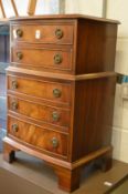 A small mahogany chest of drawers.