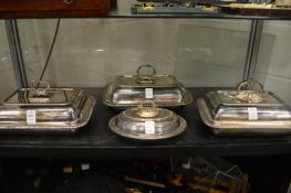 Three rectangular entree dishes and covers together with a small oval entree dish and cover.