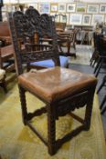 An old carved oak hall chair.