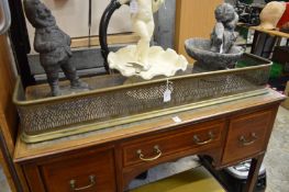 A pierced brass fender.