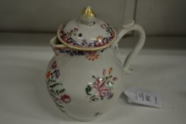 A Chinese famille rose jug and cover.
