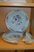 A pair of Chinese famille rose plates (one broken).