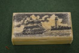 A small bone box with engraved hinged lid.