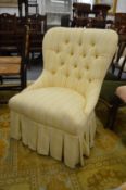 A modern yellow striped upholstered button back bedroom chair.