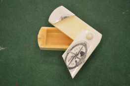 A small bone mystery box with engraved cover.