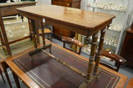 A Victorian walnut stretcher table with parquetry top.