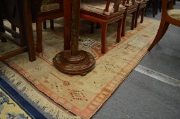 A Persian style carpet, rust and cream ground with stylised decoration 290cm x 205cm.