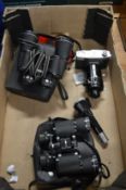 A camera, two lenses and two binoculars.