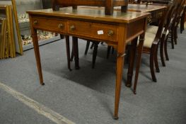 An Edwardian mahogany two drawer writing table.