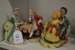 A pair of porcelain figure groups.