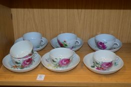 A set of six Continental porcelain cups and saucers and a spare cup.