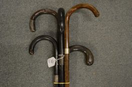 Five various walking sticks.