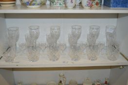 A shelf of drinking glasses.