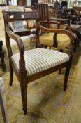 A 19th century mahogany elbow chair.