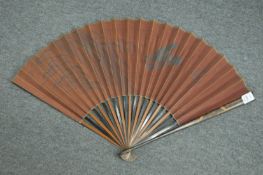 A Japanese fan with lacquer decoration.