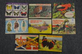 A small group of Brookbond tea cards in albums.