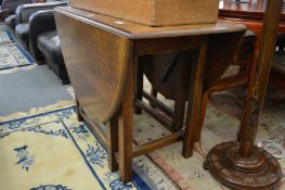 An oak drop leaf dining table
