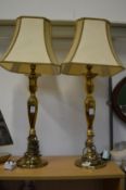 A pair of brass table lamps.