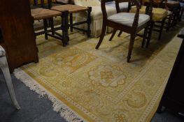 A yellow ground Persian style carpet 4m x 3m.