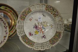 A Continental floral decorated dish with pierced border.
