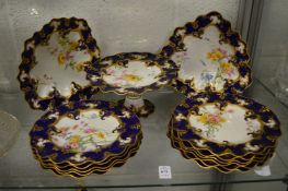 A Royal Crown Derby dessert service comprising comport, pair of leaf shaped dishes and eleven plates