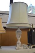 An alabaster urn shaped table lamp.