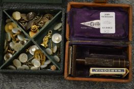 A box of studs and cufflinks and a travelling razor set.