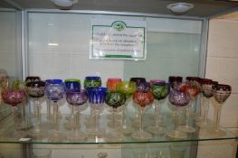 A good collection of cut glass, coloured hock glasses.