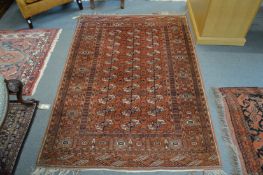 A modern Bokhara rug 185cm x 130cm.