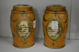 A pair of reproduction tin tea cannisters.