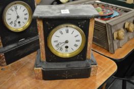 A slate mantel clock.